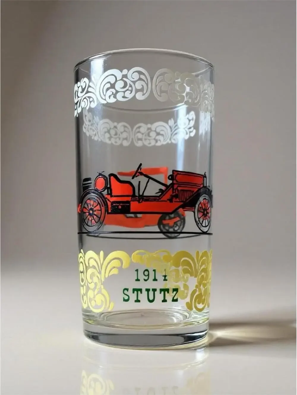 Vintage glass tumblers with early automobile designs 3